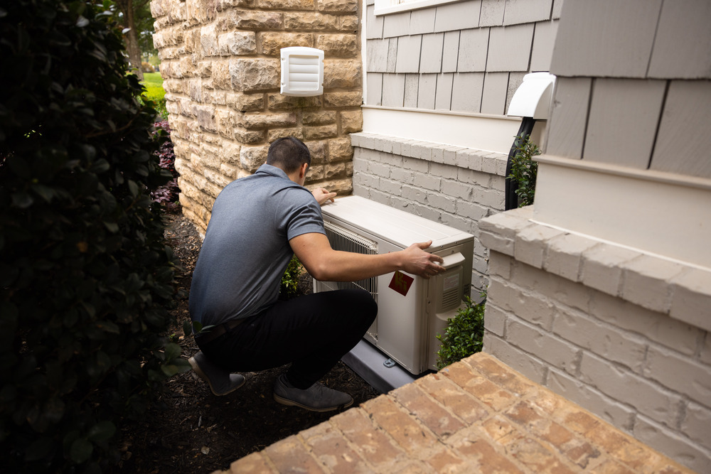 HVAC technician servicing outdoor unit